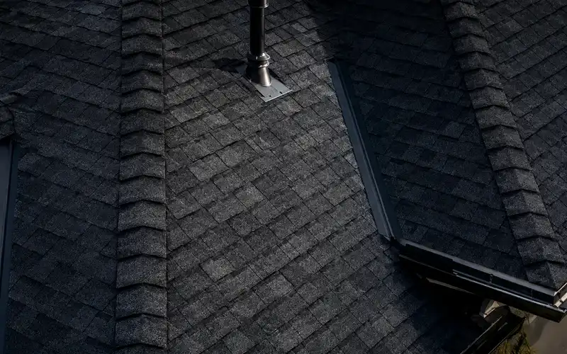 Close-up roof documentation showing vent pipe, flashing, shingles, and roof ridge lines